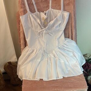 White Sleeveless Dress with Ruffle Skirt